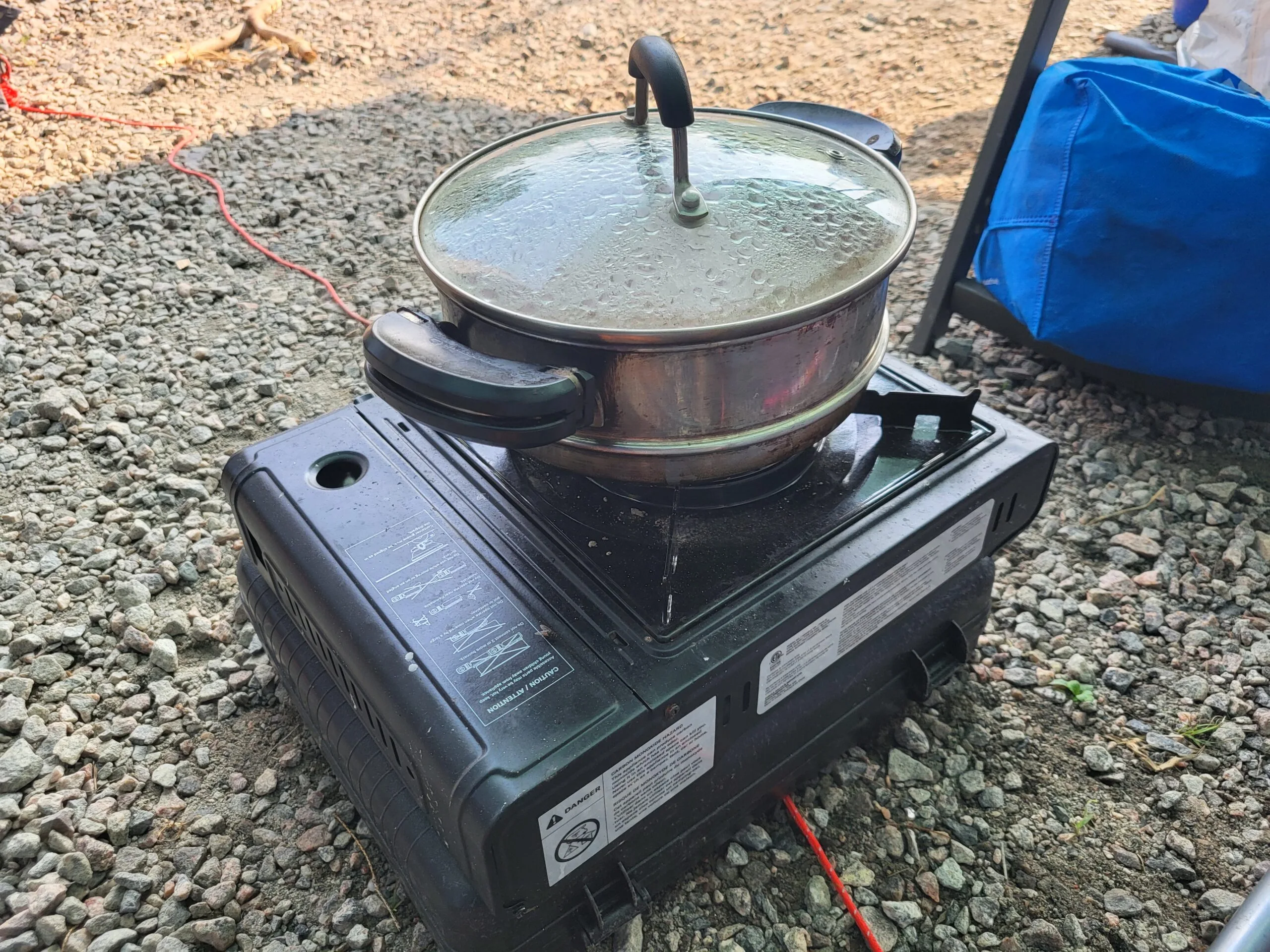 Utensils on a gas stove: Important Items you need for camping.