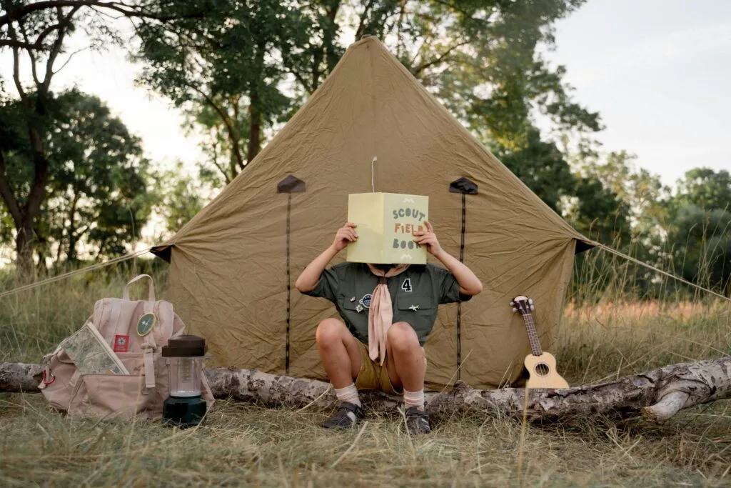 A child with the scout field book